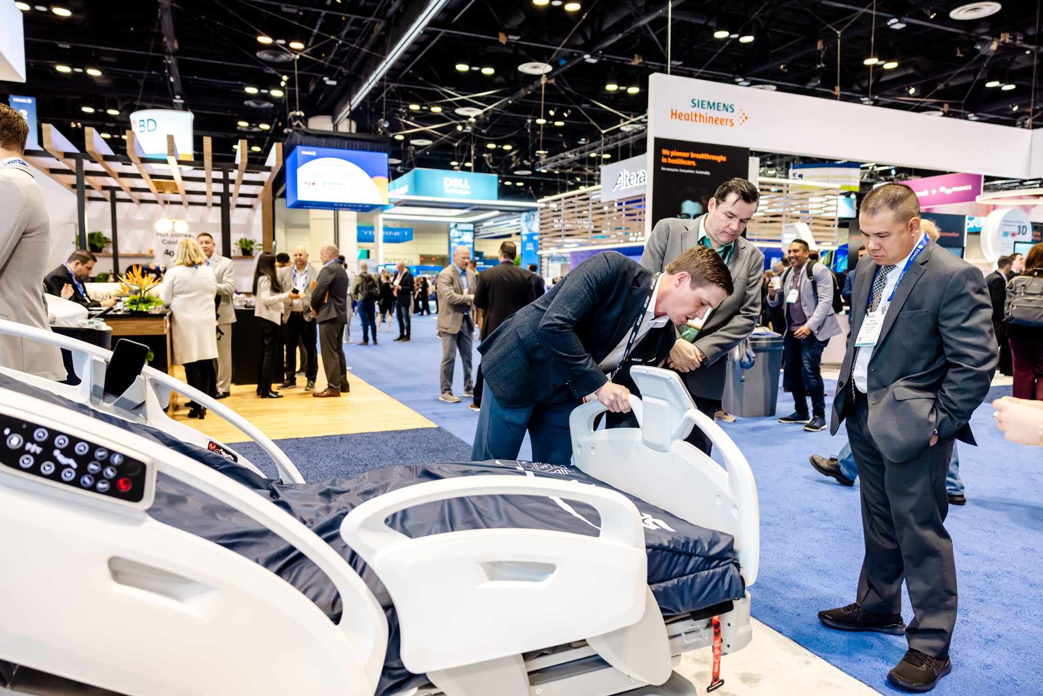 Healthcare professionals exploring technologies at the HIMSS25 Patient Engagement 365 Pavilion to improve patient care and engagement.