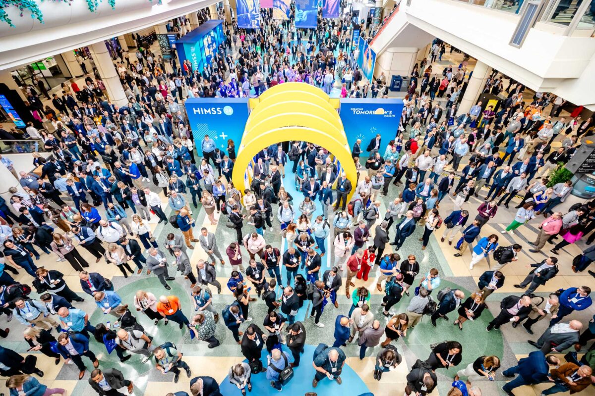 Aerial view of attendees gathered at the HIMSS Global Health Conference & Exhibition entrance.