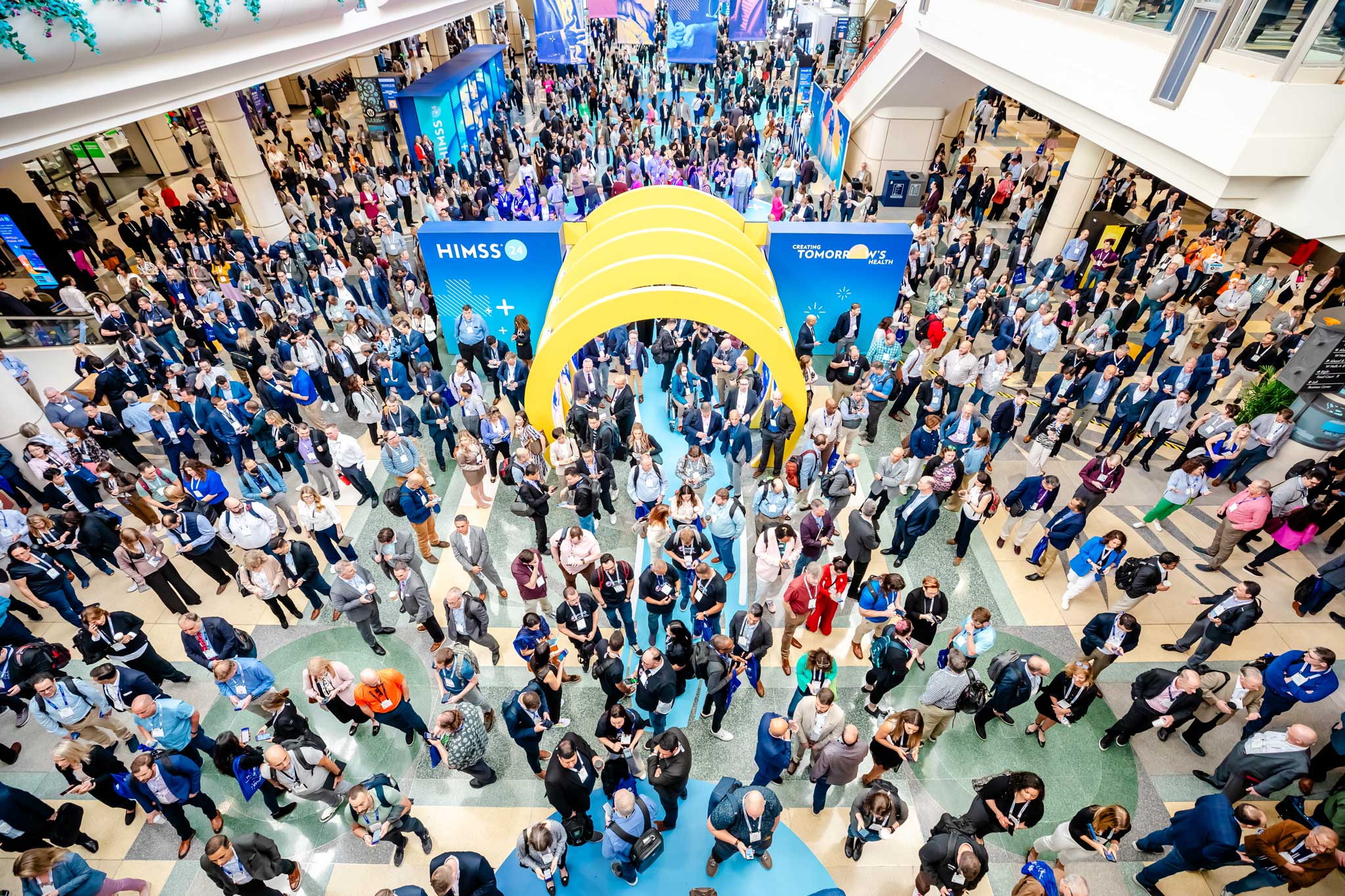 Aerial view of attendees gathered at the HIMSS Global Health Conference & Exhibition entrance.