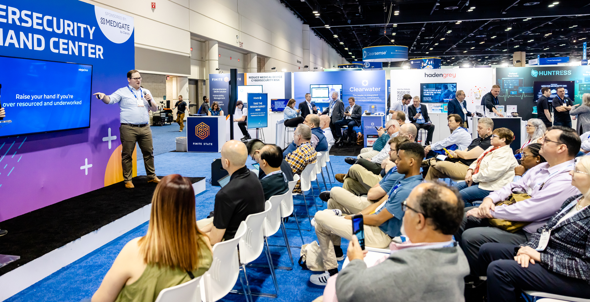 Healthcare professionals exploring cybersecurity solutions at the HIMSS25 Cybersecurity Command Center.