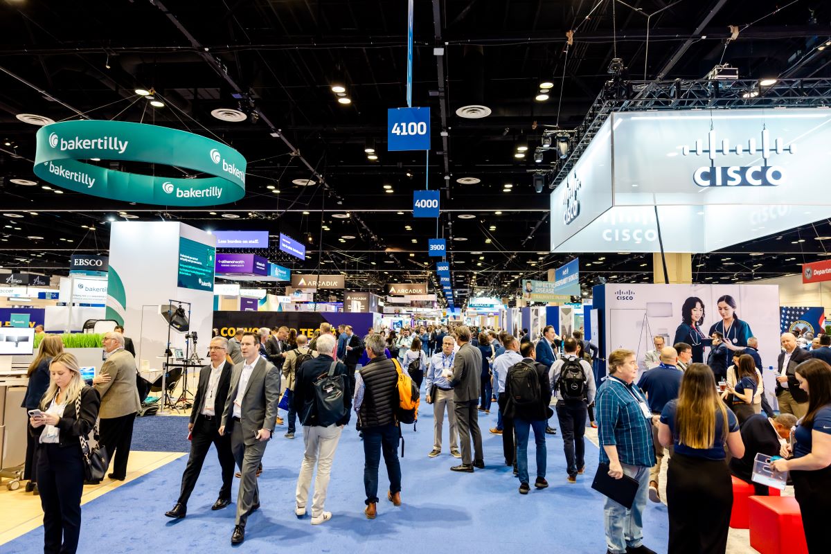 Diverse healthcare professionals networking at HIMSS25 conference