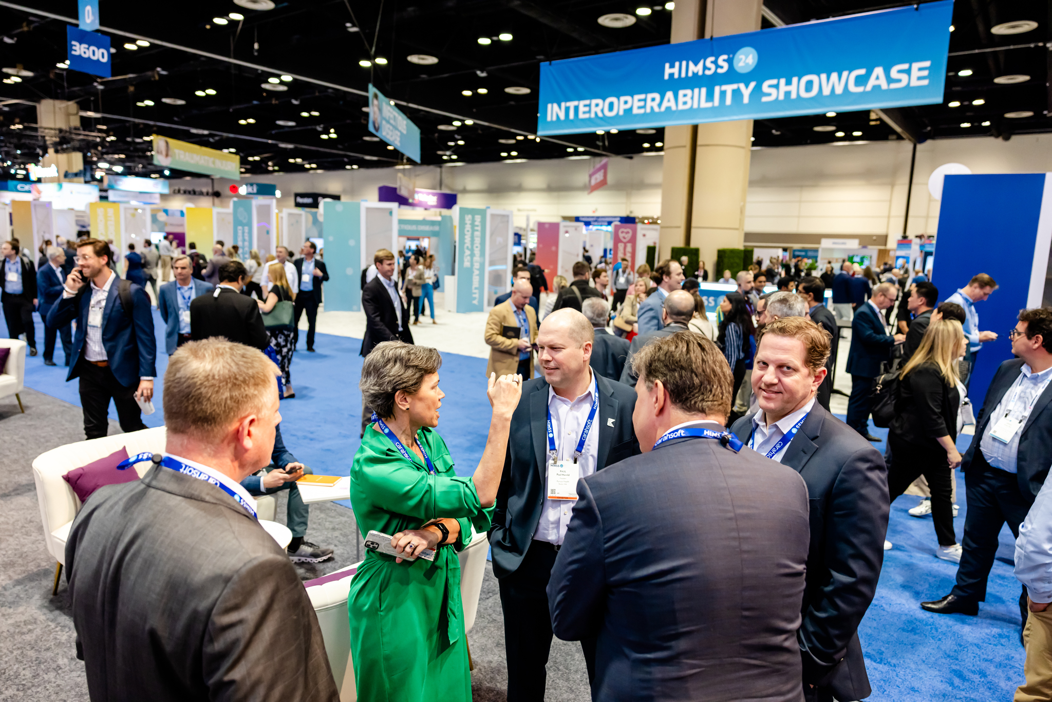 Attendees exploring interoperability solutions and SMART on FHIR technologies at the HIMSS25 Interop & SMART Experience Pavilion.