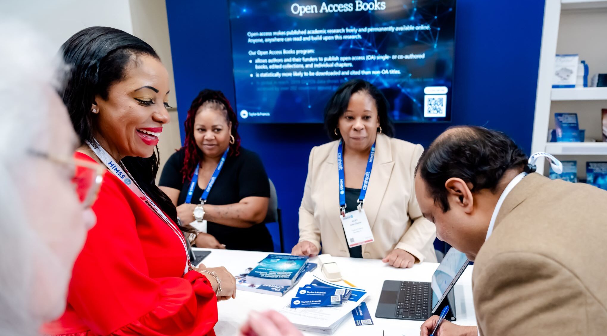 Attendees browsing healthcare and health IT books at the Taylor & Francis Bookstore at HIMSS25.